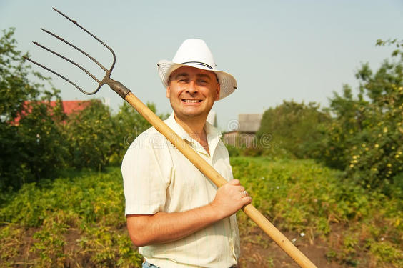 farmer-holding-pitchfork-17667567.jpg